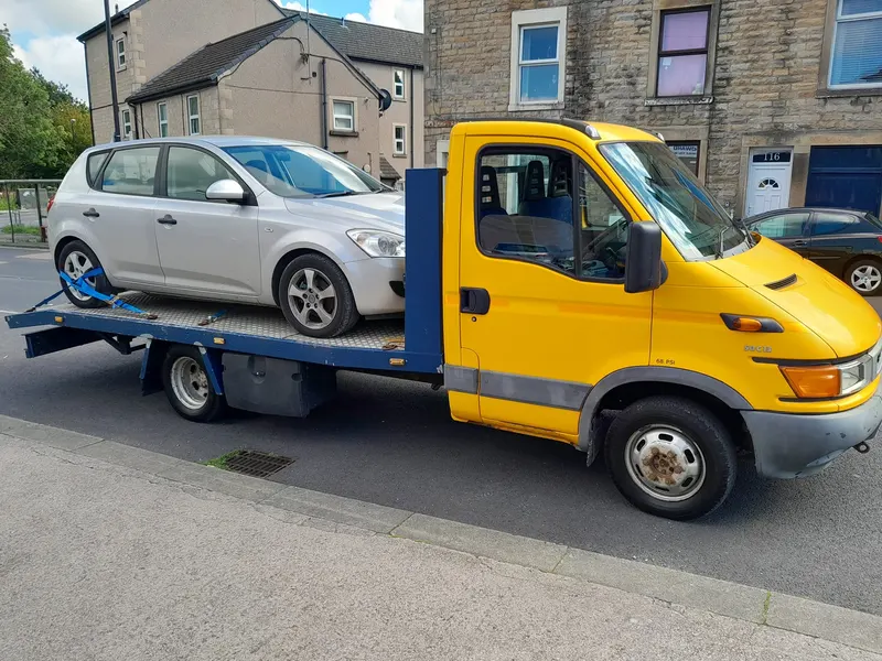Recovery truck collecting a car bought for scrap in Chorley